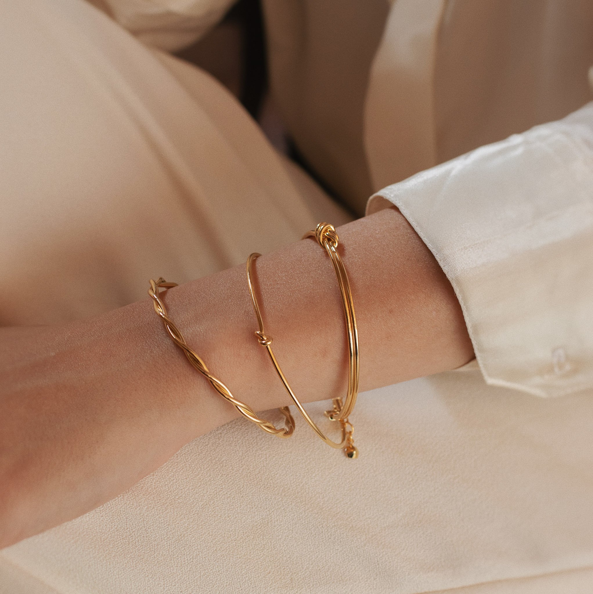 BRACELETE TRANÇADO DOURADO FOLHEADO