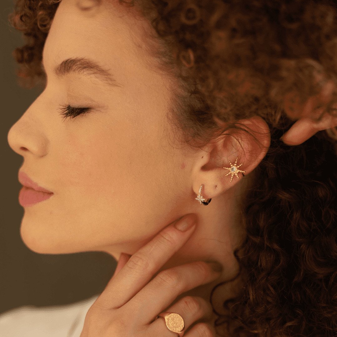 PIERCING ESTRELA COM ZIRCÔNIA DOURADO FOLHEADO