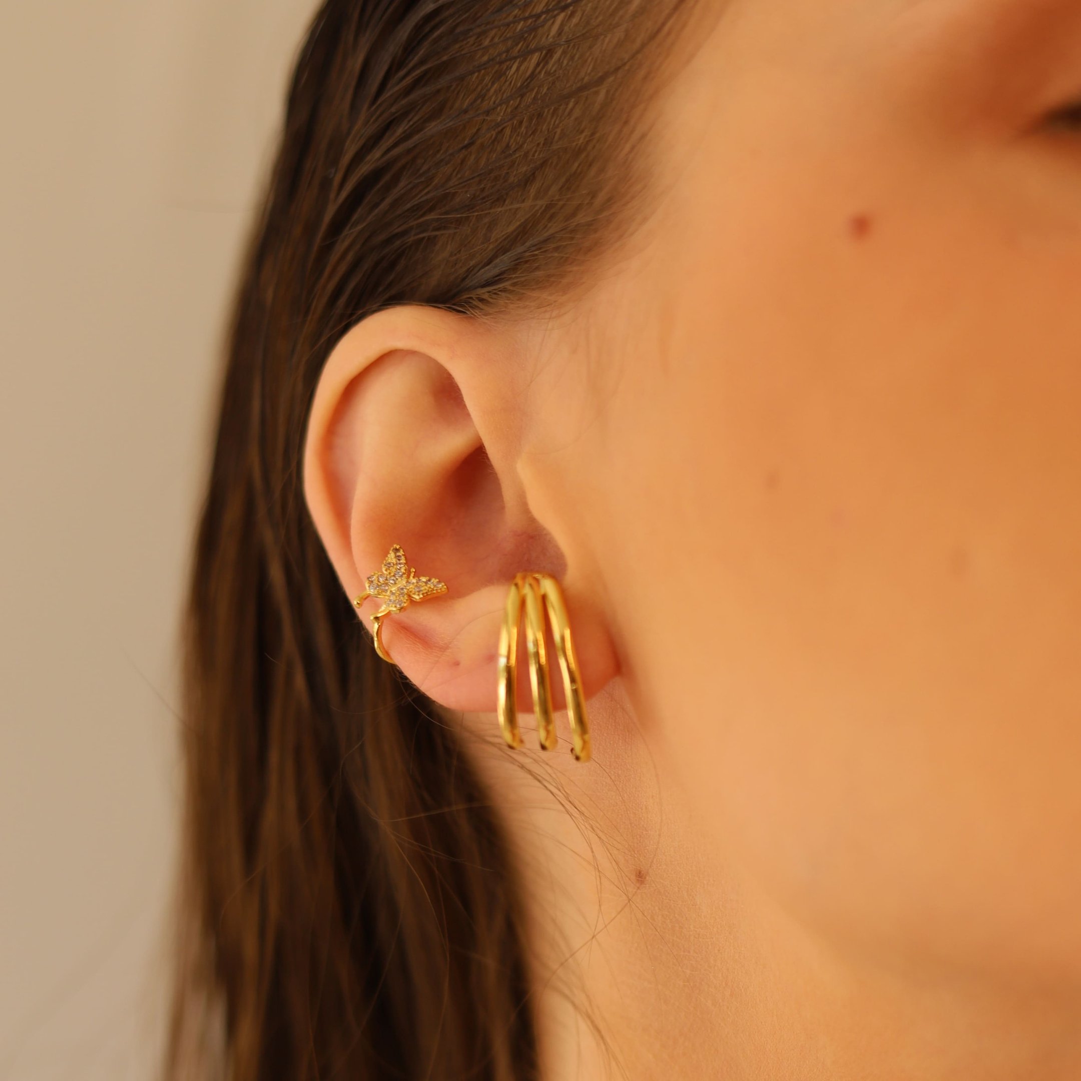 PIERCING BORBOLETA COM ZIRCONIA DOURADO FOLHEADO