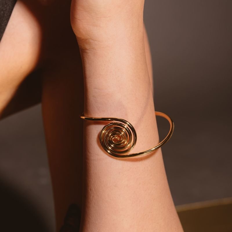 BRACELETE RIGIDO ASPIRAL DOURADO FOLHEADO