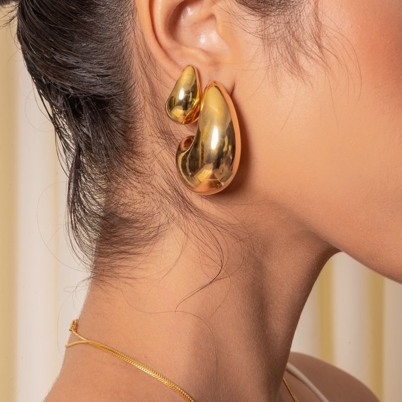 BRINCO HAILEY ABAULADA 16X20MM ABS DOURADO FOLHEADO