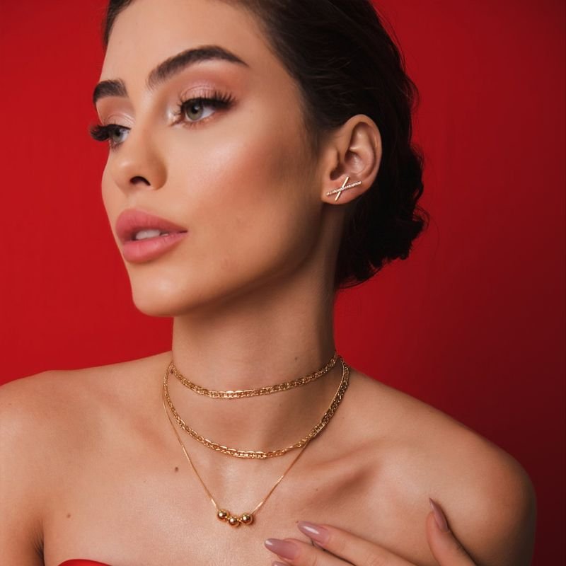 BRINCO X COM ZIRCONIAS DOURADO FOLHEADO