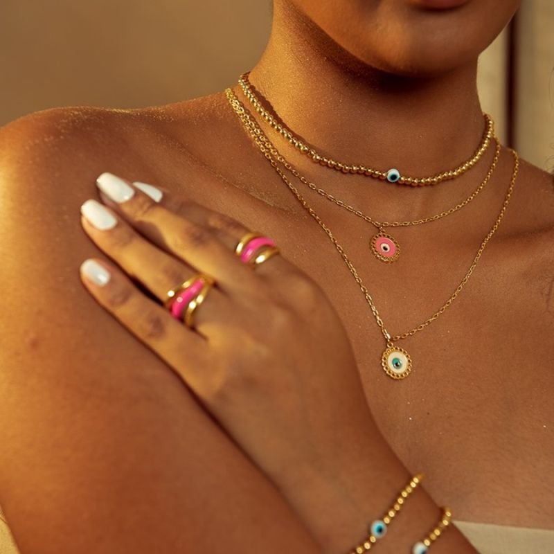 CHOKER BOLINHAS ABS COM OLHO GREGO DOURADO FOLHEADO