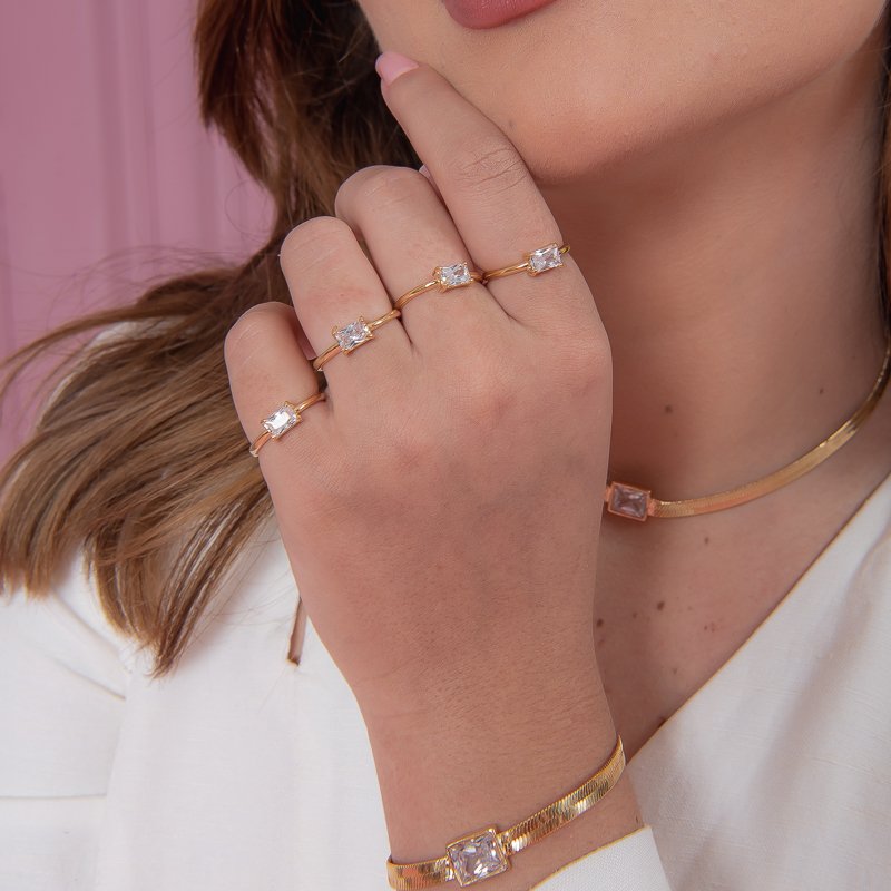 ANEL PEDRA RETANGULAR MINI CRISTAL DOURADO FOLHEADO