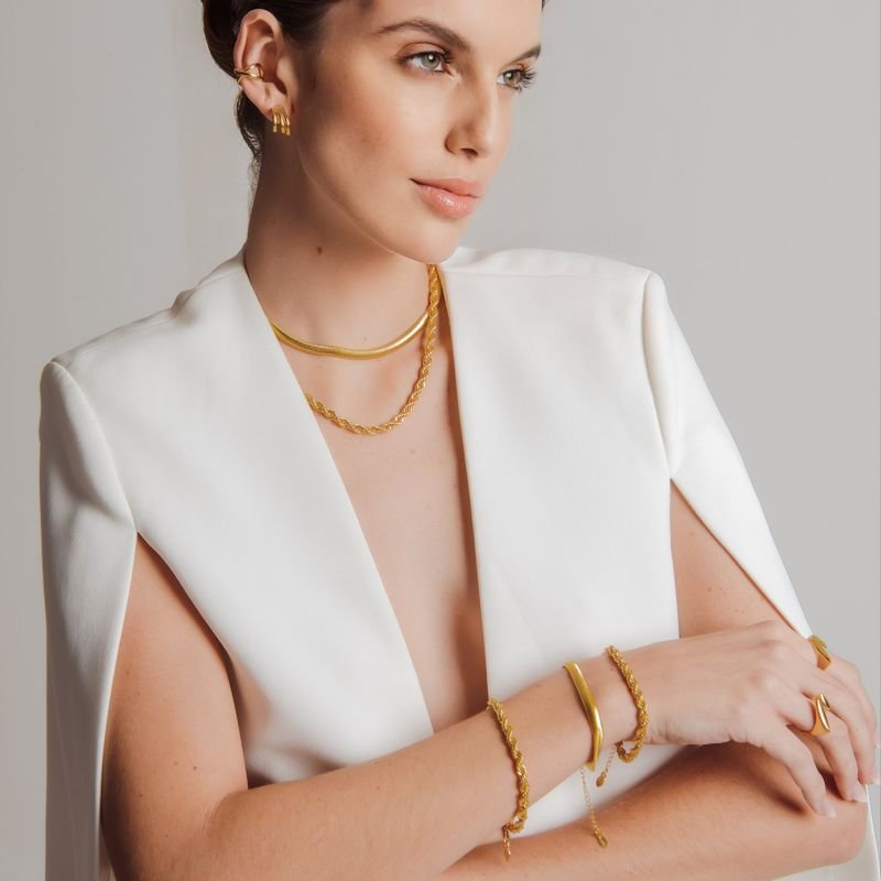 PIERCING X LISO M DOURADO FOLHEADO