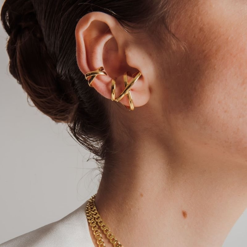 PIERCING X LISO P DOURADO FOLHEADO