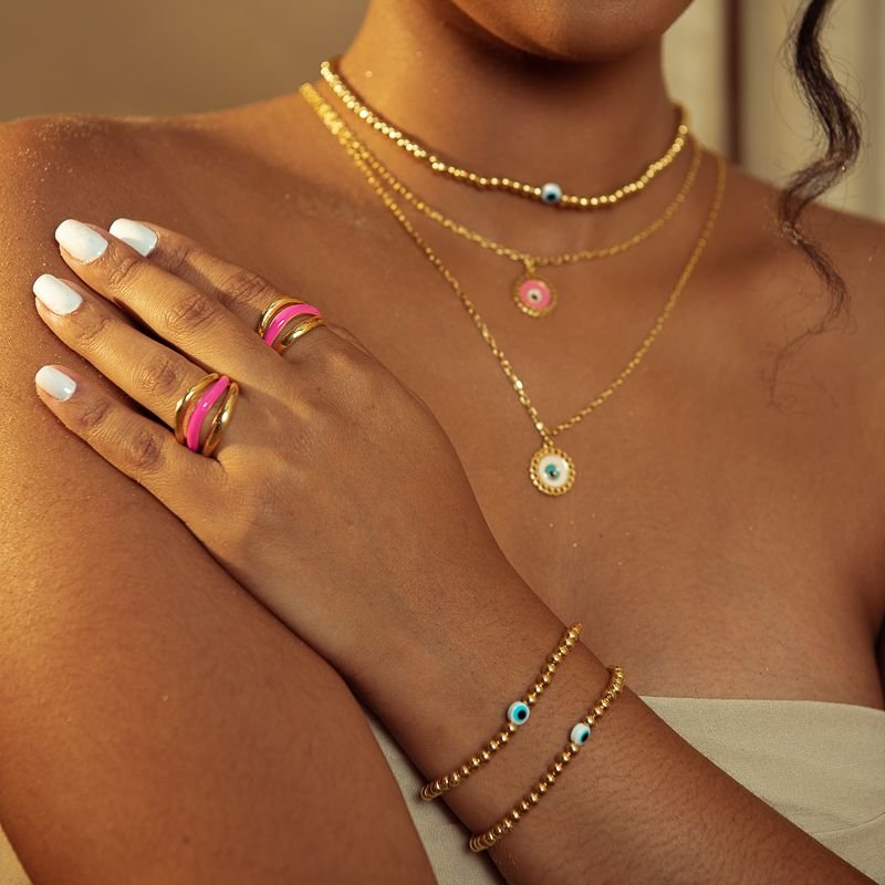 PULSEIRA BOLINHAS ABS COM OLHO GREGO DOURADO FOLHEADO