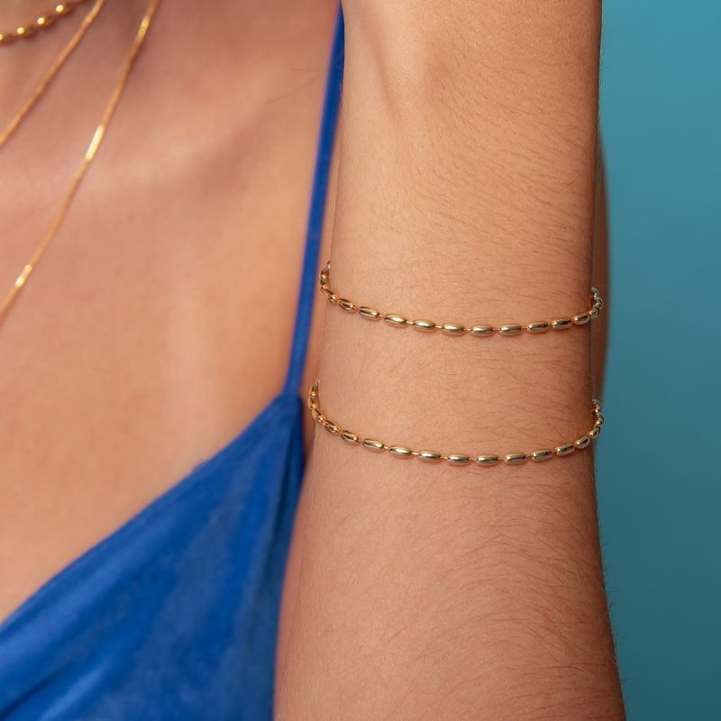 PULSEIRA CAPSULA LISA DOURADO FOLHEADO