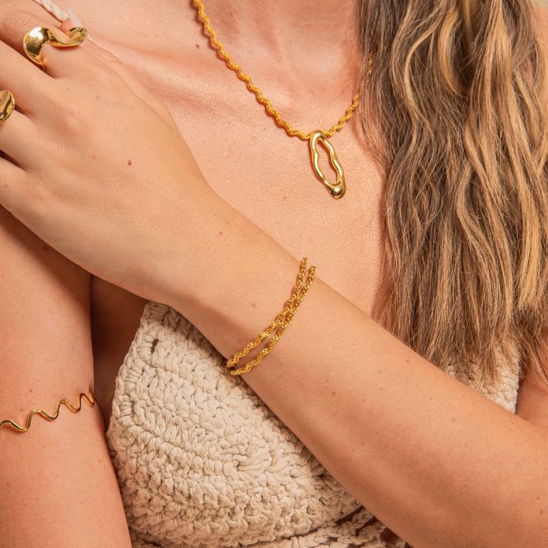 PULSEIRA ONDAS TRANÇADAS DOURADO FOLHEADO