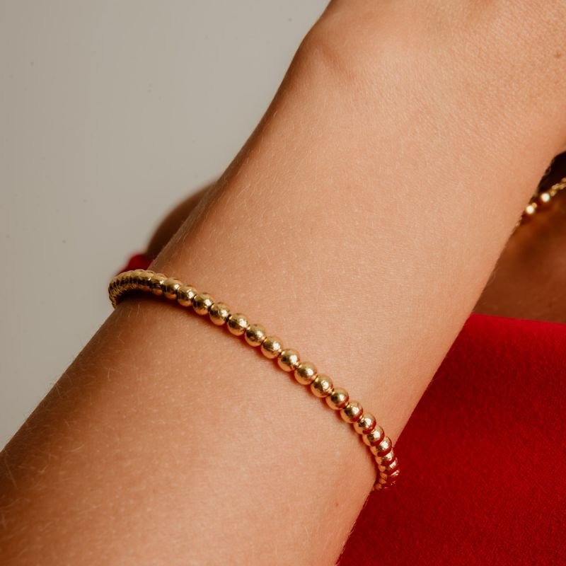 PULSEIRA ORGÂNIC ESFERAS ABS DOURADO FOLHEADO